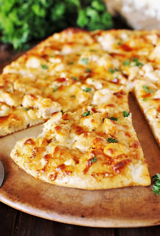 <p>The Kitchen is My Playground</p><p>Buffalo chicken pizza...all the great taste of traditional Buffalo wings...without the mess!</p><p><strong>Get the recipe: <a href="https://www.thekitchenismyplayground.com/2011/05/buffalo-chicken-pizza-neater-than.html" rel="nofollow noopener" target="_blank" data-ylk="slk:Buffalo Chicken Pizza;elm:context_link;itc:0;sec:content-canvas" class="link ">Buffalo Chicken Pizza</a></strong></p>