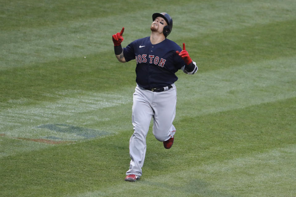 Boston Red Sox's Christian Vazquez reacts after hitting a solo home run during the second inning of the baseball game against the New York Mets at Citi Field, Thursday, July 30, 2020, in New York. (AP Photo/Seth Wenig)