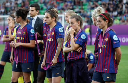 Soccer Football - Women's Champions League Final - Ferencvaros Stadium, Budapest, Hungary - May 18, 2019 Barcelona's Aitana Bonmati and team mates look dejected with their medals after losing the Women's Champions League final REUTERS/Bernadett Szabo