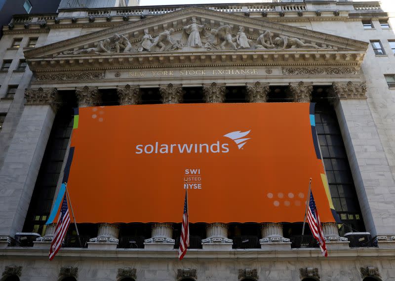 FILE PHOTO: SolarWinds Corp. banner hangs on the company's IPO at the NYSE in New York