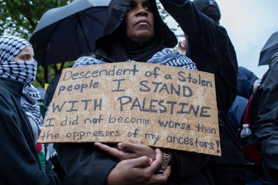 A demonstrator holds a sign in front of the White House last month during a Day of Action for Palestine event. Though many Black Americans are addressing the Mideast conflict, BLM PAC adviser Angela Angel cited a survey noting that foreign policy is low on Black American voters’ priority list. (Photo by Probal Rashid/LightRocket via Getty Images)
