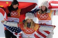 <p>Gold medalist Chloe Kim of the United States, silver medalist Jiayu Liu of China, and bronze medalist Arielle Gold of the United States, all celebrate their victories together during the Women's Snowboard Halfpipe Final ceremony on day four of the PyeongChang 2018 Winter Olympic Games in February 2018.</p>