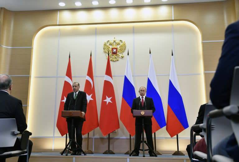 Russian President Vladimir Putin (R) and his Turkish counterpart Recep Tayyip Erdogan give a press conference following their meeting at the Bocharov Ruchei state residence in Sochi on May 3, 2017