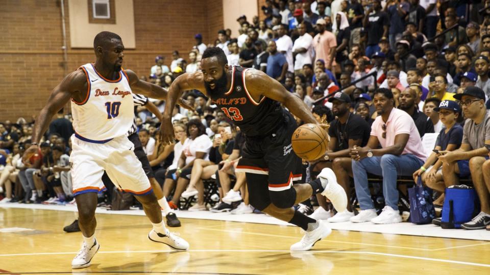 Rockets' James Harden, right, and Hawks' Tim Hardaway Jr. play the Drew League in 2017.