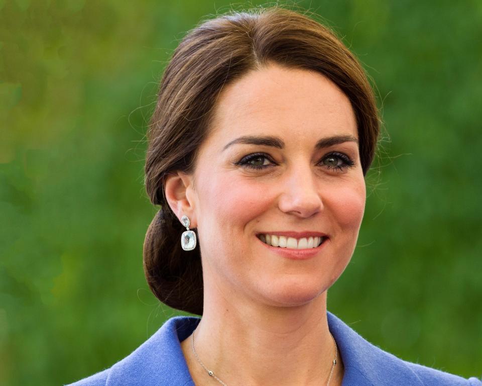 Kate Middleton recycled a rich blue dress for the wedding of a family friend, Sophie Carter, over the weekend.