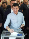 Ukrainian President Volodymyr Zelenskiy casts a ballot at a polling station during a parliamentary election in Kiev, Ukraine, Sunday, July 21, 2019. Ukrainians are voting in an early parliamentary election in which the new party of President Volodymyr Zelenskiy is set to take the largest share of votes. (AP Photo/Evgeniy Maloletka)