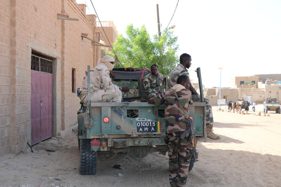 Malian forces patrol the streets of Timbuktu, Mali, Sunday Sept. 26, 2021. Many residents of Timbuktu are worried that when French troops pull out of the city in northern Mali, jihadis will return to impose strict Shariah law including public whippings and amputations. The Islamic extremists ruled Timbuktu in 2012 and banned music, sports and destroyed historic mausoleums, saying they were idolatrous. (AP Photo/Moulaye Sayah)