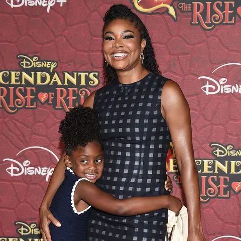 <p>Lisa O'Connor/Shutterstock</p> Gabrielle Union and her daughter Kaavia