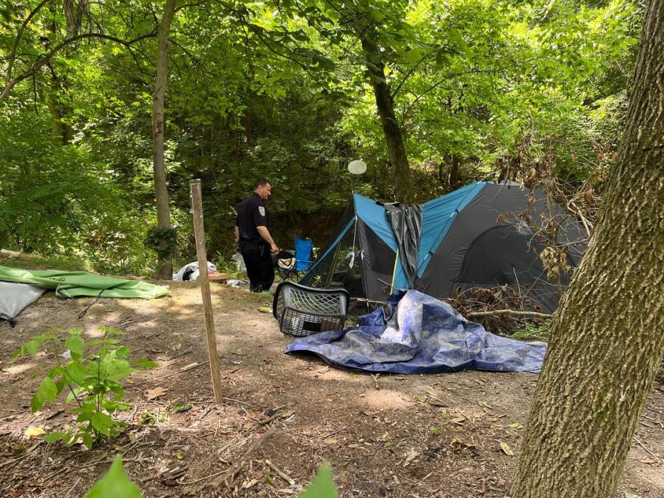 Swansea Police Chief Matt Blomberg returns to a squatters camp along the MetroBikeLink Trail last week to see if people had left after receiving a notice from code-enforcement officials to vacate. Teri Maddox/tmaddox@bnd.com