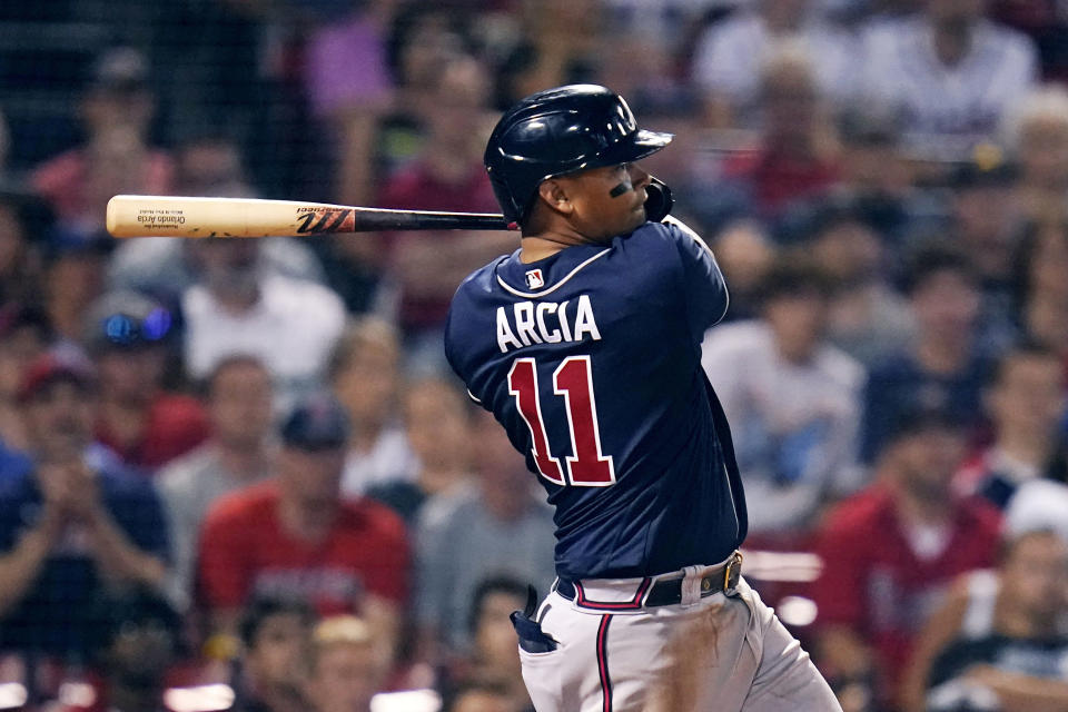 Atlanta Braves' Orlando Arcia hits an RBI single, breaking a 6-6 tie, during the tenth inning of a baseball game against the Boston Red Sox, Tuesday, Aug. 9, 2022, in Boston. (AP Photo/Charles Krupa)