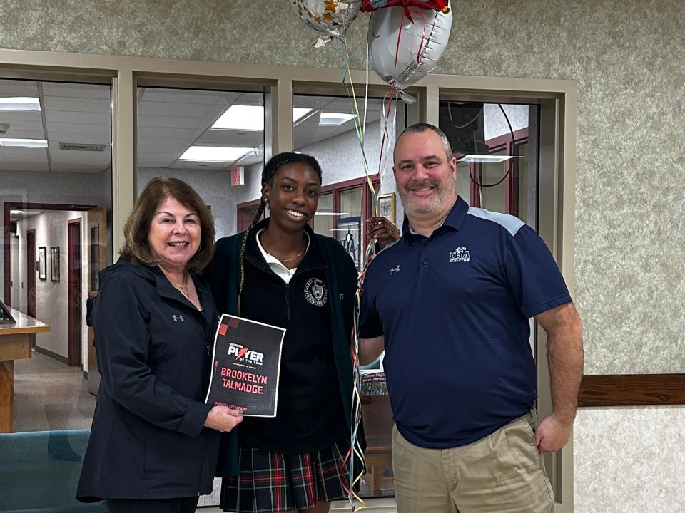 Immaculate Heart Academy's Brookelyn Talmadge (center) - pictured with Mrs. Maria Nolan, IHA volleyball coach, and Mr. Steve Ferro, IHA athletic director - is the 2022-23 Gatorade New Jersey Volleyball Player of the Year.