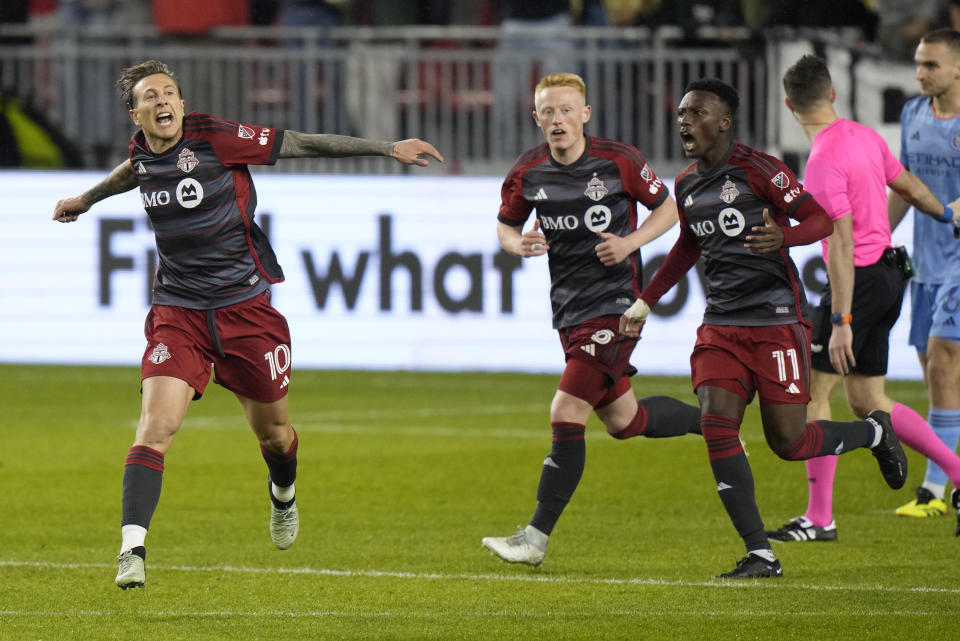 Toronto FC forward Federico Bernardeschi (10) celebrates his goal against NYC FC with midfielder Matty Longstaff (8) and forward Latif Blessing (11) during the second half of an MLS soccer match Saturday, May 11, 2024, in Toronto. (Frank Gunn/The Canadian Press via AP)