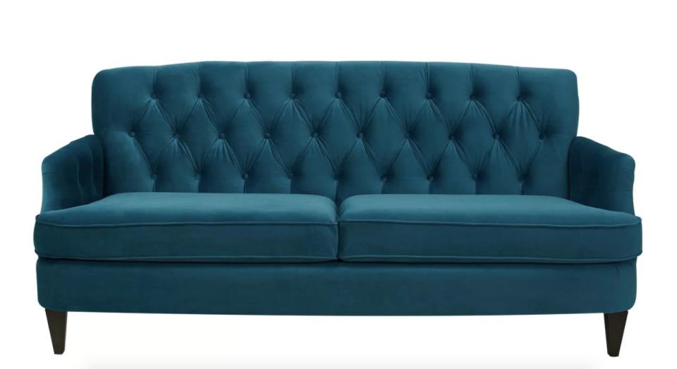 Add some traditional flair with <a href="https://www.allmodern.com/furniture/pdp/kaylynn-sofa-wrlo7908.html?piid=22814726" target="_blank">this unique tufted sofa</a> that's an ideal choice for your living room, den, office, or really any space in your home.