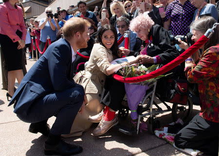 Meghan, Duchess of Sussex and Prince Harry, Duke of Sussex meet Dafney Dunne during a visit at the Sydney Opera House in Sydney, Australia, October 16, 2018. Paul Edwards/Pool via REUTERS