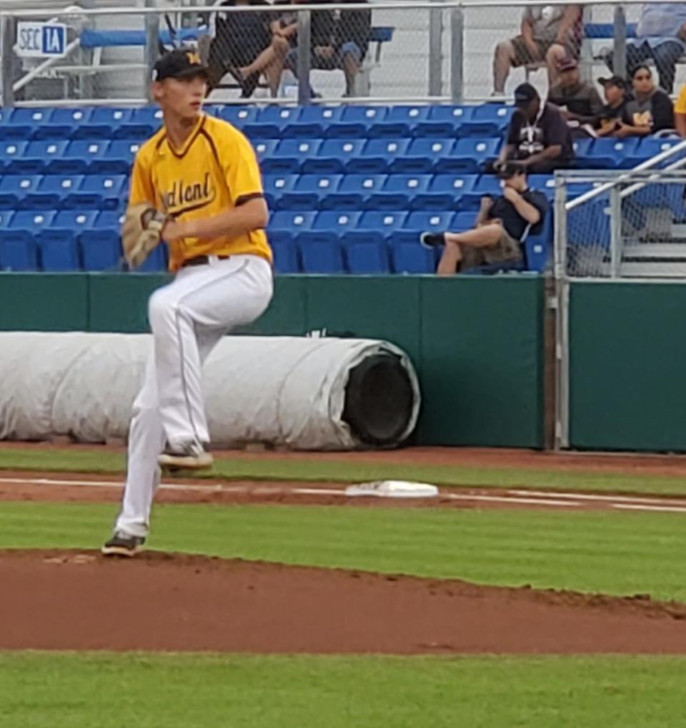 Evan Whiteaker of the Midland (OH) Baseball Team prepares to deliver a pitch in the first inning of their pool play game, Saturday, July 24, 2021, against the Albuquerque Baseball Academy in the Connie Mack World Series.