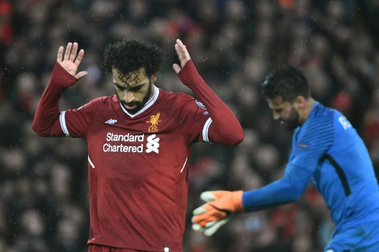 Salah celebrates after scoring in the semi-final against Roma at Anfield