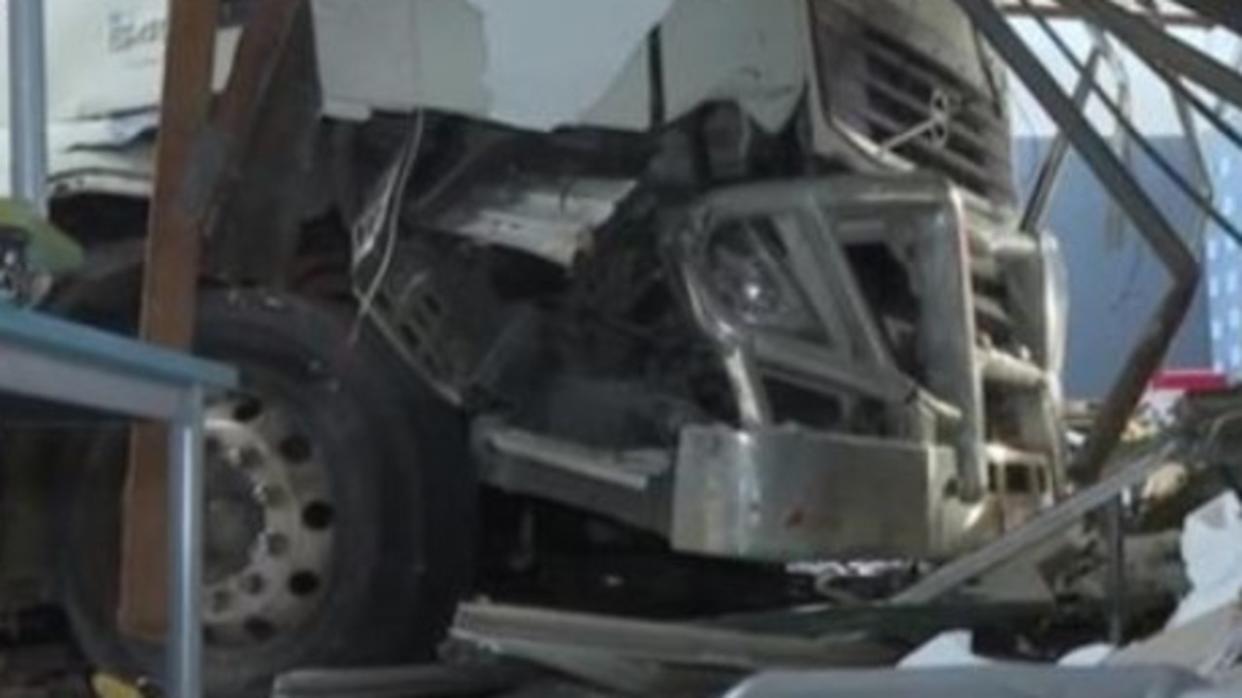 Multiple vehicles and a school building were damaged when a truck drove through an intersection at Moorebank, Sydney, on June 29, 2024. Picture: 7News