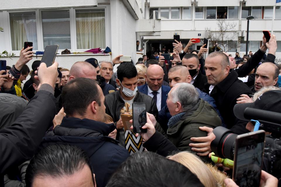 Serbian tennis player Novak Djokovic (pictured) walks surrounded by fans in the coastal city of Budva on January 28, 2022.