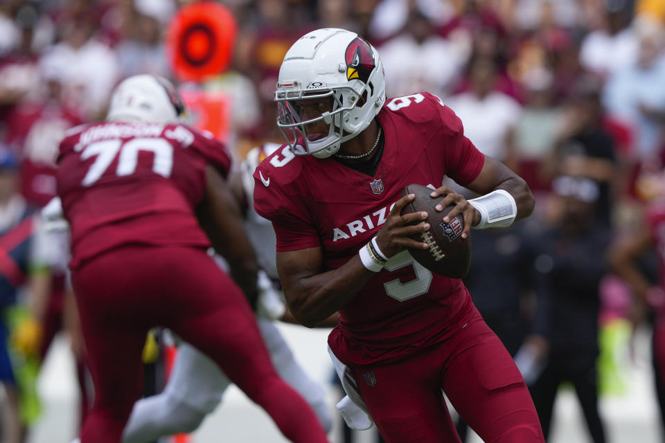 Arizona Cardinals quarterback Joshua Dobbs (9) scrambles out of the pocket during the first half of an NFL football game against the Washington Commanders, Sunday, Sept. 10, 2023, in Landover, Md. (AP Photo/Susan Walsh)