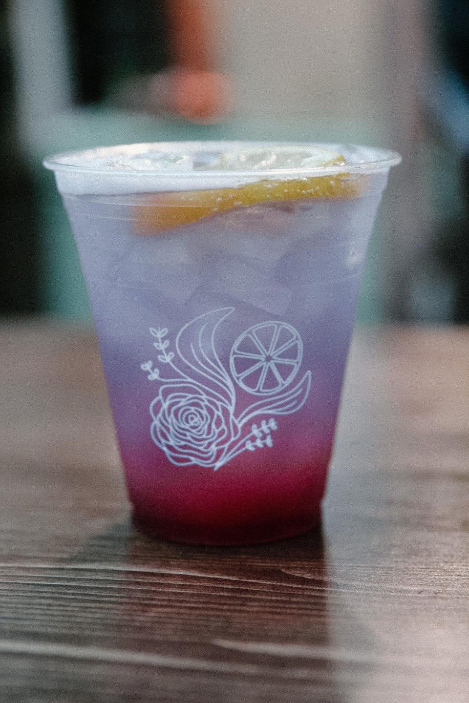Roll Up Herbal Bar's Something Signature mocktail is made with lavender, fresh rosemary, lemon zest and seltzer and served with a lemon wheel and lavender bitters.