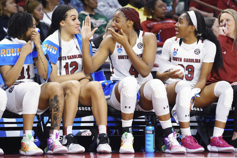 South Carolina forward Aliyah Boston (4) laughs with Brea Beal (12), Bree Hall, right, and Kierra Fletcher, left, during the second half of the team's first-round college basketball game against Norfolk State in the women's NCAA Tournament, Friday, March 17, 2023, in Columbia, S.C. (AP Photo/Sean Rayford) HOLD for Mike Stewart