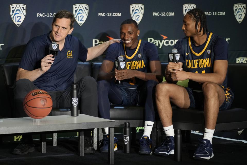 California coach Mark Madsen, left, speaks beside players Keonte Kennedy, center, and Grant Newell during a news conference at the Pac-12 basketball media day Wednesday, Oct. 11, 2023, in Las Vegas. | John Locher, Associated Press