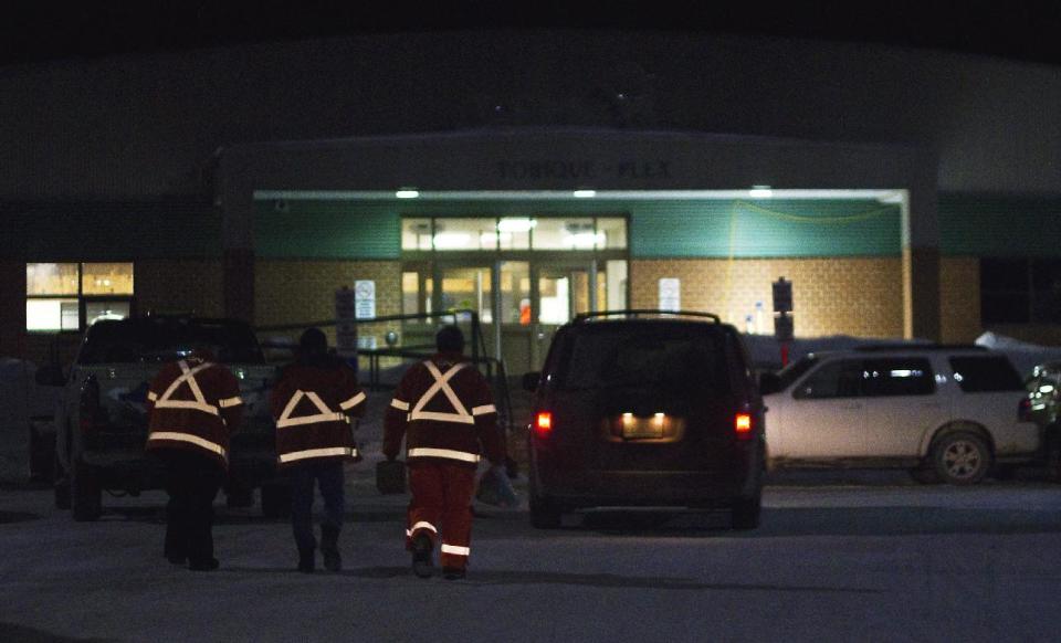 Canadian National Railway personnel congregate at the Tobique-Plex in Plaster Rock, New Brunswick, Canada on Wednesday Jan. 8, 2014. A Canadian National Railway freight train carrying crude oil and propane derailed Tuesday night in a sparsely populated region of northwestern New Brunswick. More than 100 residents remained evacuated from their homes. There were no deaths or injuries. (AP Photo/The Canadian Press, Tom Bateman)