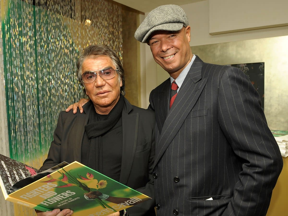 Michael Roberts (right) with Roberto Cavalli in 2009 (Getty Images for IMG)