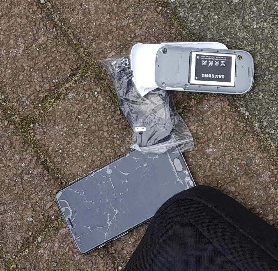 In this image released by the Dutch Defense Ministry on Thursday Oct. 4, 2018, one of the many phones belonging to four Russian officers of the Main Directorate of the General Staff of the Armed Forces of the Russian Federation, GRU, is seen after one of the four officers tried to destroy it when they were caught on April 13, 2018. The officers were expelled from the Netherlands for allegedly trying to hack into the chemical watchdog OPCW's network. The Dutch defense minister on Thursday Oct. 4, 2018, accused Russia's military intelligence unit of attempted cybercrimes targeting the U.N. chemical weapons watchdog and the investigation into the 2014 Malaysian Airlines crash over Ukraine. (Dutch Defense Ministry via AP)