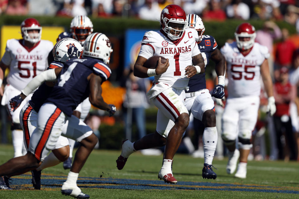 Arkansas quarterback KJ Jefferson (1) carries the ball for a first down against Auburn during the second half of an NCAA college football game Saturday, Oct. 29, 2022, in Auburn, Ala. (AP Photo/Butch Dill)