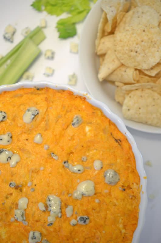 <p>Platter Talk</p><p>Spicy buffalo dip features all the great taste of classic buffalo wings but in the form of a mouthwatering dip. Perfect for a graduation party...just be sure to have copies of the recipe to hand out - you're going to need them!</p><p><strong>Get the recipe: <a href="http://www.plattertalk.com/buffalo-chicken-wing-dip/" rel="nofollow noopener" target="_blank" data-ylk="slk:Buffalo Chicken Wing Dip;elm:context_link;itc:0;sec:content-canvas" class="link ">Buffalo Chicken Wing Dip</a></strong></p>