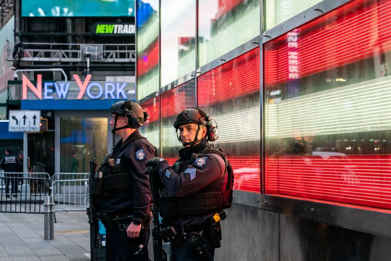 New York City police officers stand guard after a shooting incident in Times Square, New York