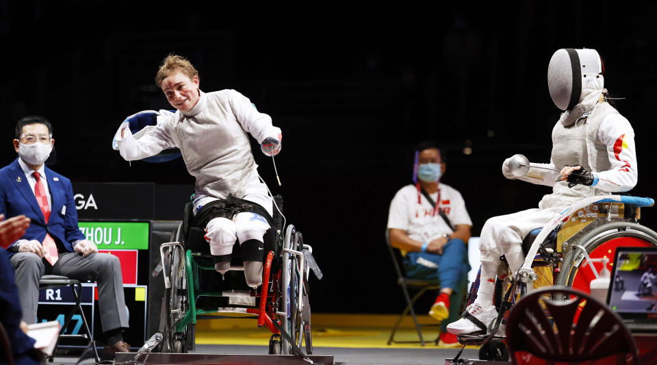 FILE - In this Saturday, Aug. 28, 2021 file photo, Italy's Beatrice Maria Vio, left, celebrates after winning over China's Zhou Jingjing during their the wheelchair fencing women's foil Individual category B gold medal match in Chiba, near Tokyo, at the Tokyo 2020 Paralympic Games, in Tokyo, Japan. When Ursula von der Leyen was lost for words to capture the soul of the European Union and its future on Wednesday, Sept. 15, 2021, Bebe Vio was there to help out the EU's top official at the end of her State of the Union address. Sitting anonymously among the European legislators for most of the hour-long speech which is a highlight on the EU calendar, the Italian Paralympic fencer suddenly became the center of attention when the Commission president called her out as the guest of honor of the august proceedings. (Kyodo News via AP, File)