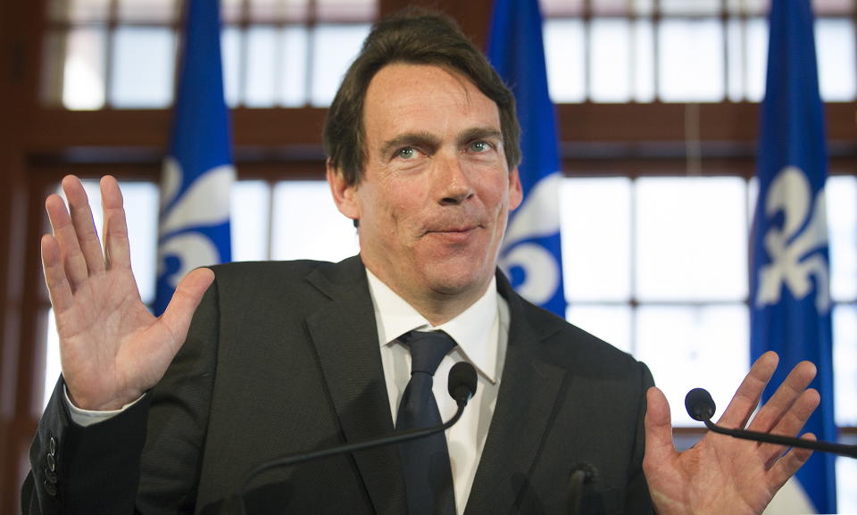 Pierre Karl Peladeau gestures during a press conference in Saint Jerome, Quebec, Sunday, March 9, 2014, announcing him as a Parti Quebecois candidate for that riding on day five of the Quebec provincial election campaign. (AP Photo/The Canadian Press, Graham Hughes)