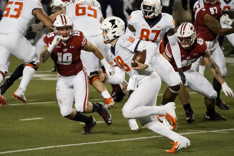 Illinois quarterback Brandon Peters runs during the second half of an NCAA college football game against Wisconsin Friday, Oct. 23, 2020, in Madison, Wis. Wisconsin won 45-7. (AP Photo/Morry Gash)