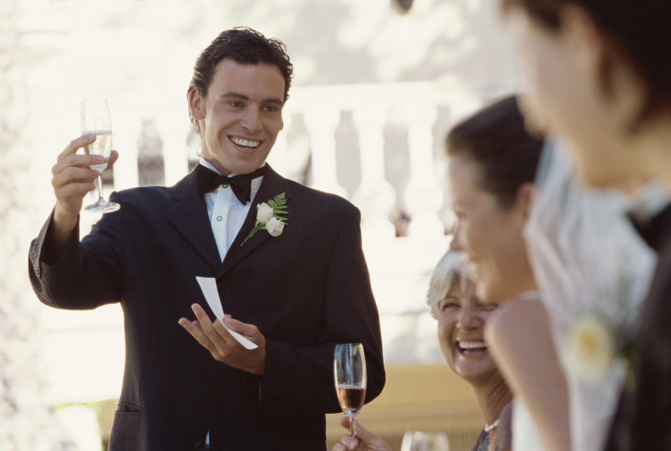 Best man toasting at a reception