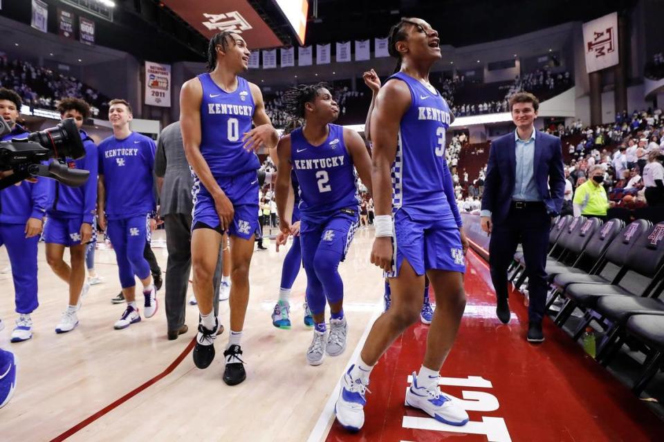 Kentucky’s Jacob Toppin (0), Sahvir Wheeler (2) and TyTy Washington (3) celebrate after Wednesday night’s 64-58 defeat of Texas A&M at Reed Arena in College Station.