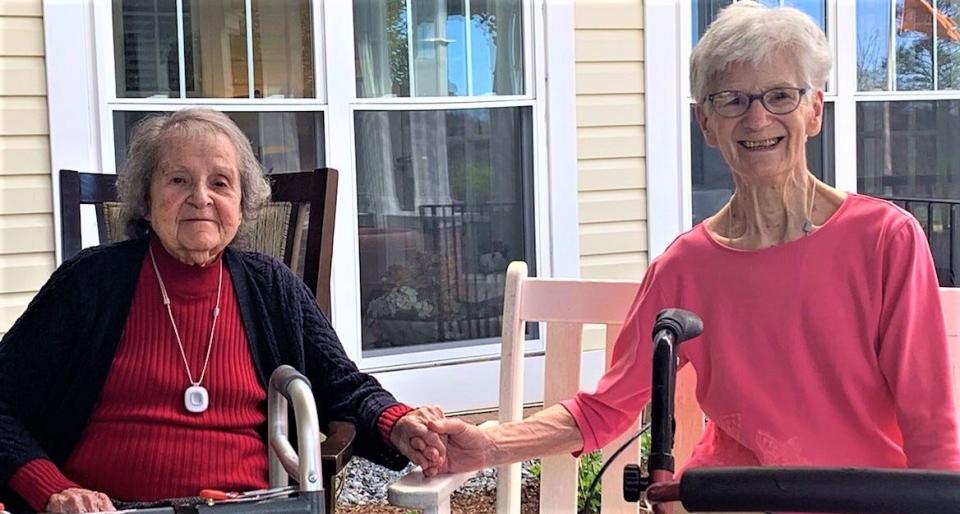 Lillian Etkind, 102, and her new friend, Marian Graczyk, 87, on the porch together at Sunrise Senior Living in Cohasset.