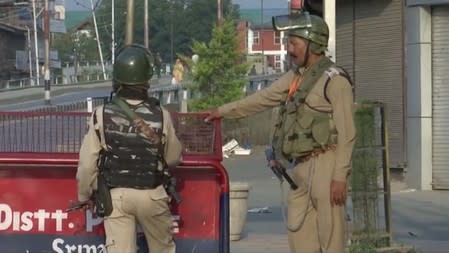 Security personnel stands guard in Srinagar