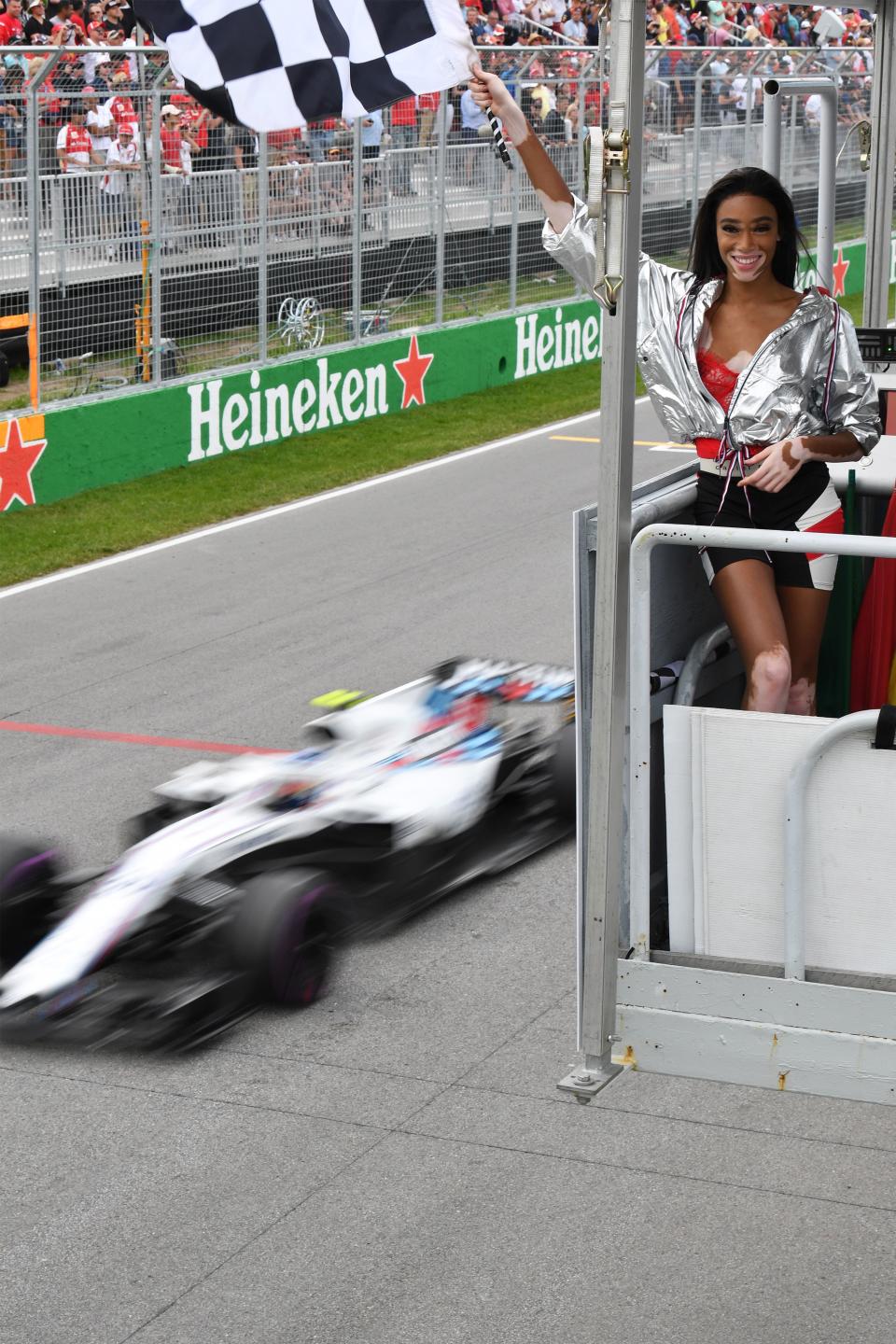 It’s behind you: Model Winnie Harlow gets that all-important ‘chequered flag a lap early’ shot. It’s almost as if F1 bosses thought the photo opp was more important than the race