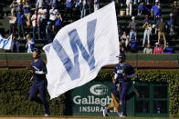 Chicago Cubs right fielder Seiya Suzuki, left, of Japan, and center fielder Christopher Morel run off the field after the Cubs defeated the Cincinnati Reds 6-1 in a baseball game in Chicago, Friday, Sept. 30, 2022. (AP Photo/Nam Y. Huh)