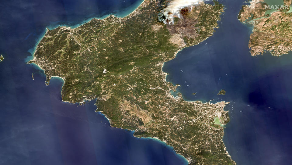 This image provided by Maxar Technologies, shows an overview of wildfires on the island of Corfu, Greece, Tuesday July 25, 2023. A third successive heat wave in Greece pushed temperatures back above 40 degrees Celsius (104 degrees Fahrenheit) across parts of the country Tuesday amid a string of evacuations from fires that have raged out of control for days. A fire service spokesman said the worst blazes were on the southeastern island of Rhodes and the northwestern island of Corfu. (Satellite image ©2023 Maxar Technologies via AP)