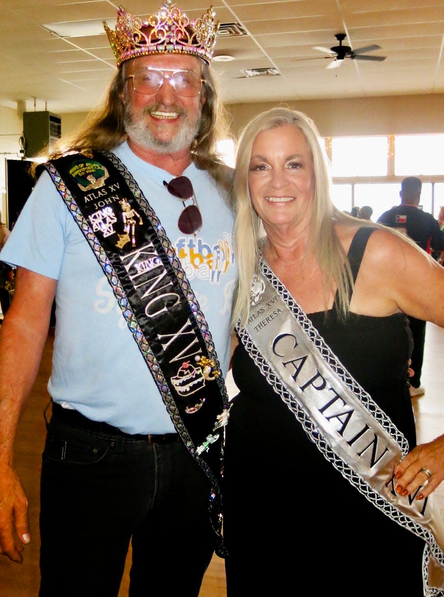 Krewe of Atlas King XV John Smith and Captain XVI
Theresa Miller are visiting krewe members at the Oceanus coronation.