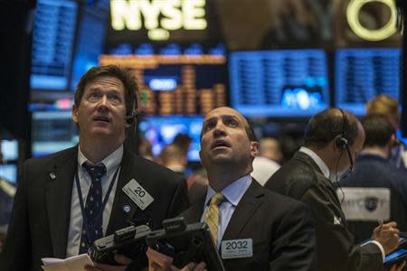 Traders work on the floor of the New York Stock Exchange May 21, 2014. REUTERS/Brendan McDermid