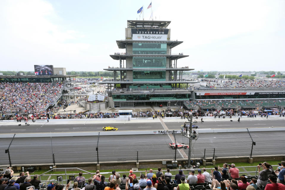 FILE - In this May 24, 2019, file photo, cars take to the track during the final practice session for the Indianapolis 500 IndyCar auto race at Indianapolis Motor Speedway in Indianapolis. The Indianapolis 500 scheduled for May 24 has been postponed until August because of the coronavirus pandemic and won't run on Memorial Day weekend for the first time since 1946. The race will instead be held Aug. 23. (AP Photo/AJ Mast, File)