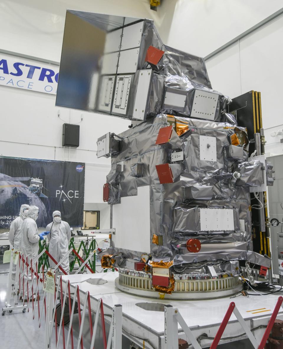 Members of the media get a closer look at NASA’s PACE satellite at Astrotech Space Operations in Titusville.