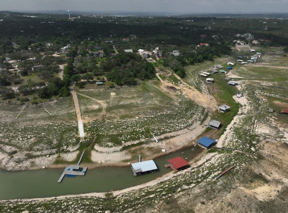 Boat docks are stranded on dry land at Hudson Bend on Lake Travis on April 29. At the time, Lake Travis was 38% full; as of Wednesday afternoon, the lake was 41.1% full and rising.