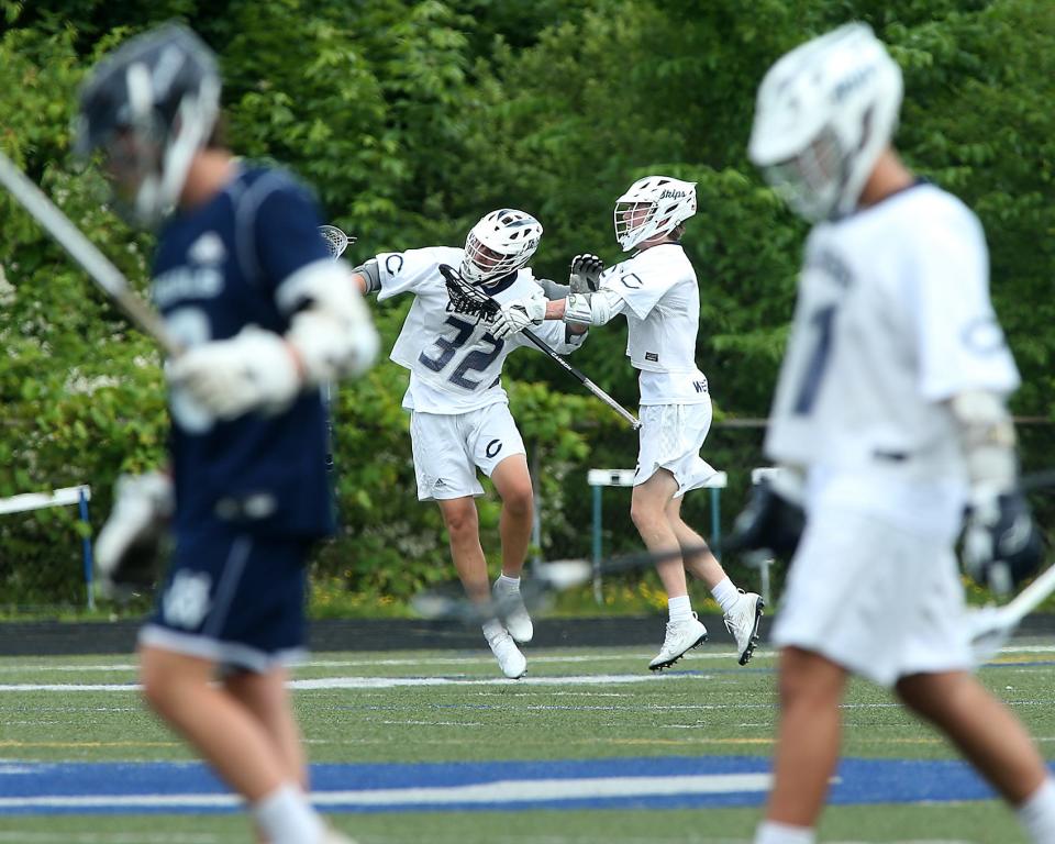 Cohasset's Charlie Donovan celebrates his goal with Cohasset's Aidan Westphalen that gave Cohasset the 3-2 lead over Hamilton-Wenham during second quarter action  of their game in the Sweet 16 round of the Division 4 state tournament at Cohasset High School on Saturday, June 11, 2022. 