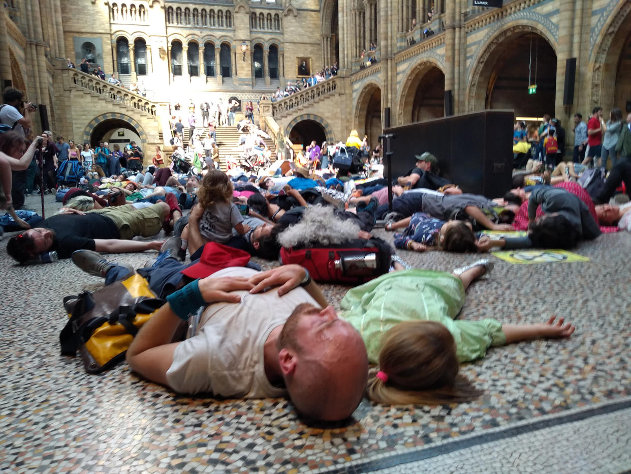 Extinction Rebellion protestors lying down inside the Natural History Museum in London. Photo: Laura Parnaby/PA Wire/PA Images.