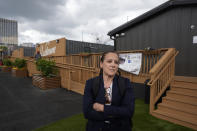 Cathryn Vassell, CEO of Partners for Home, speaks at the Melody Friday, April 12, 2024, in Atlanta. The Melody is a housing complex made from shipping containers and is intended to help house people from Atlanta's homeless population. (AP Photo/John Bazemore)